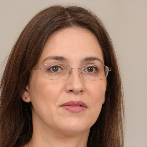 Joyful white adult female with long  brown hair and grey eyes