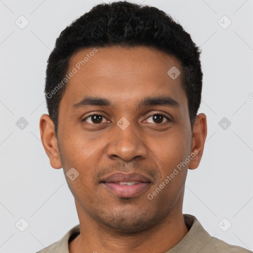 Joyful black young-adult male with short  black hair and brown eyes