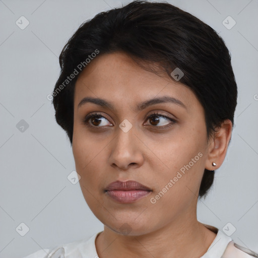 Joyful latino young-adult female with short  brown hair and brown eyes