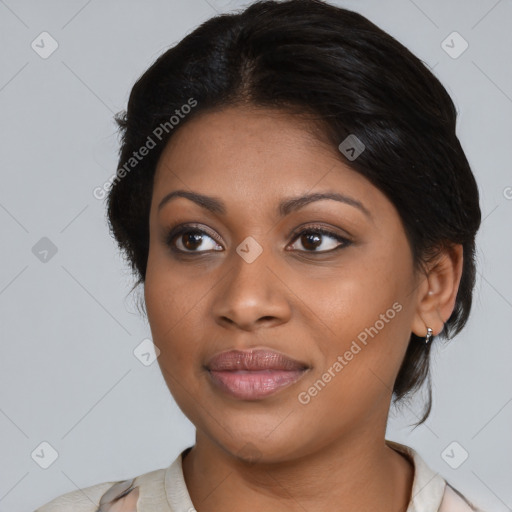 Joyful black young-adult female with medium  brown hair and brown eyes