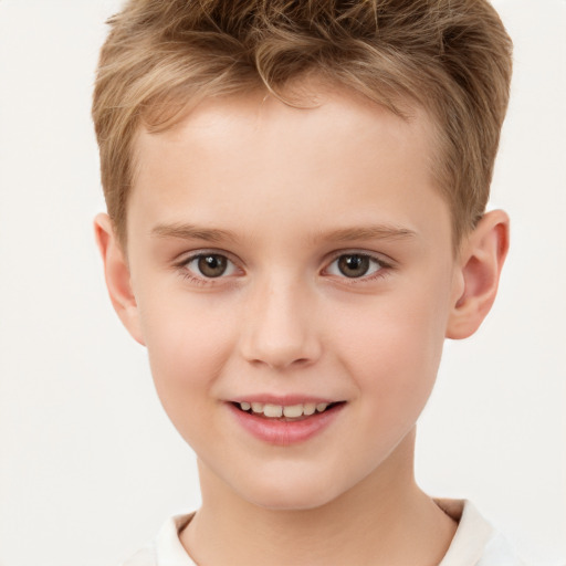 Joyful white child male with short  brown hair and brown eyes