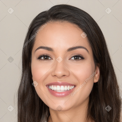 Joyful white young-adult female with long  black hair and brown eyes