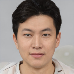 Neutral asian young-adult male with short  brown hair and brown eyes