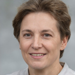 Joyful white adult female with short  brown hair and brown eyes