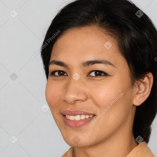 Joyful asian young-adult female with medium  brown hair and brown eyes