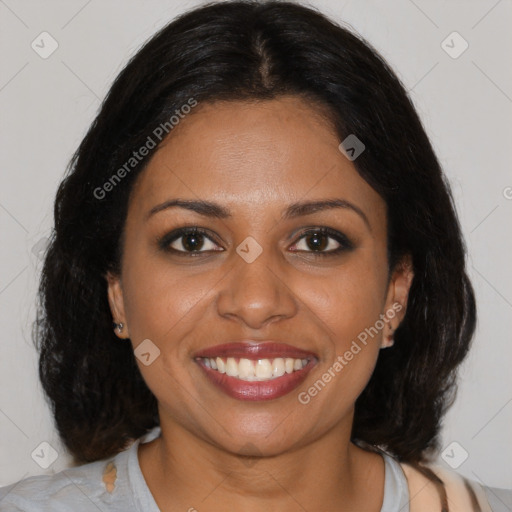 Joyful black young-adult female with medium  brown hair and brown eyes