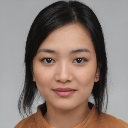 Joyful asian young-adult female with medium  black hair and brown eyes