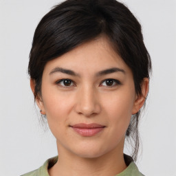 Joyful asian young-adult female with medium  brown hair and brown eyes