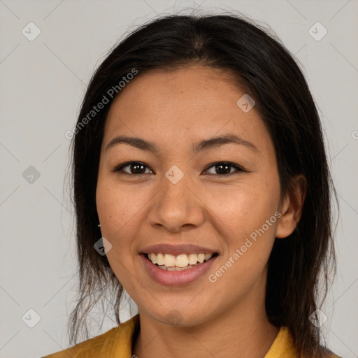 Joyful latino young-adult female with medium  brown hair and brown eyes