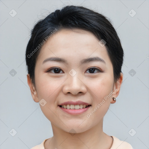 Joyful asian young-adult female with short  black hair and brown eyes