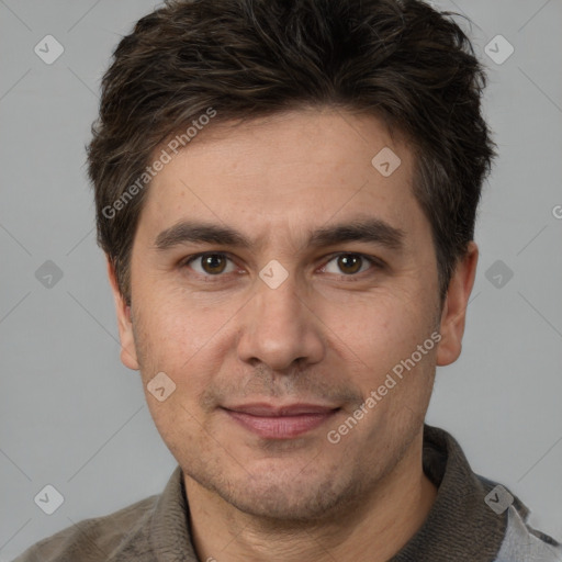 Joyful white adult male with short  brown hair and brown eyes