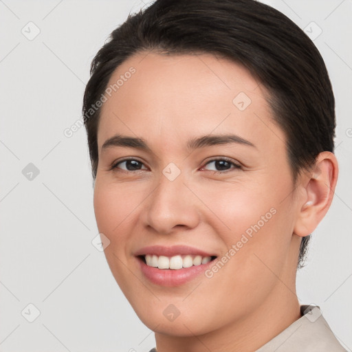 Joyful white young-adult female with short  brown hair and brown eyes