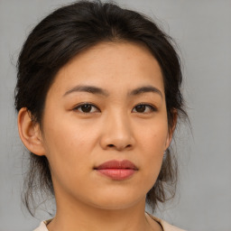 Joyful asian young-adult female with medium  brown hair and brown eyes