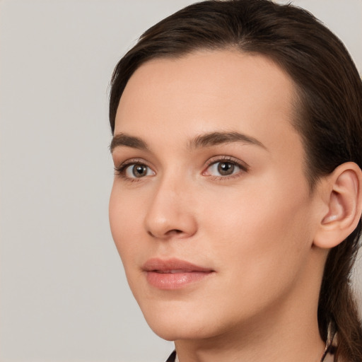 Neutral white young-adult female with medium  brown hair and brown eyes