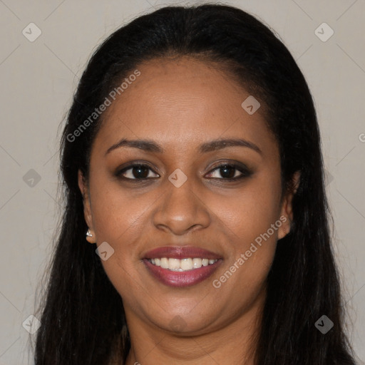 Joyful black young-adult female with long  black hair and brown eyes