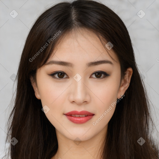 Joyful asian young-adult female with long  brown hair and brown eyes