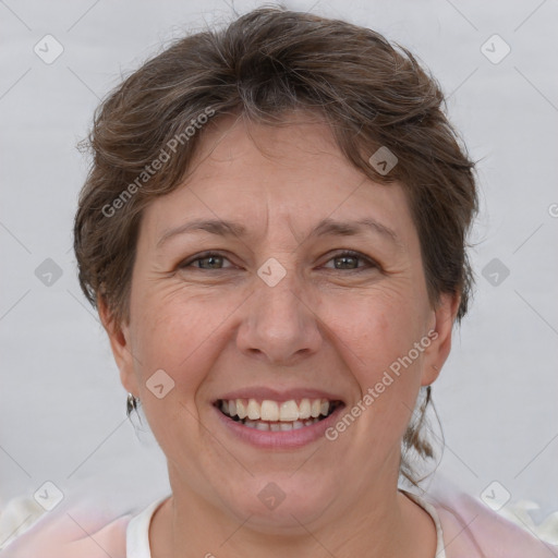 Joyful white adult female with short  brown hair and brown eyes