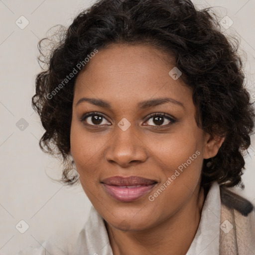 Joyful black young-adult female with medium  brown hair and brown eyes