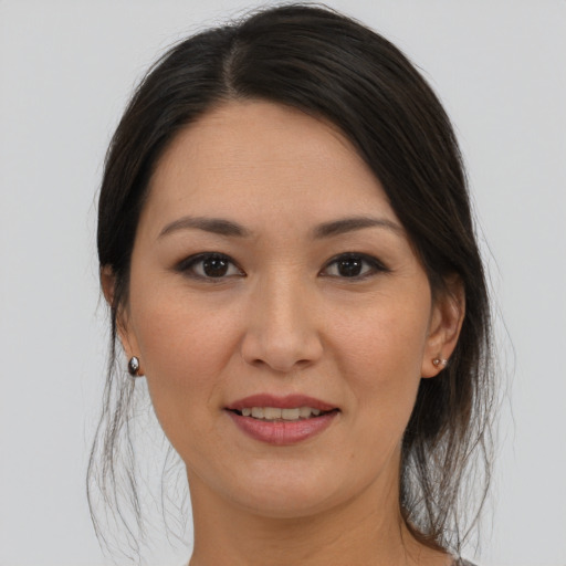 Joyful asian young-adult female with medium  brown hair and brown eyes