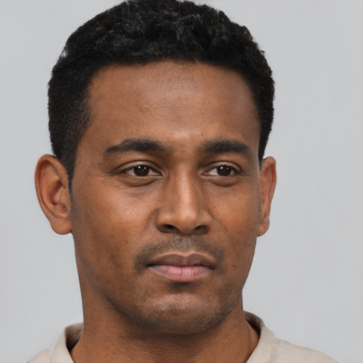 Neutral black young-adult male with short  black hair and brown eyes