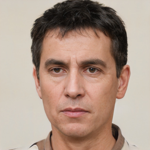 Neutral white adult male with short  black hair and brown eyes