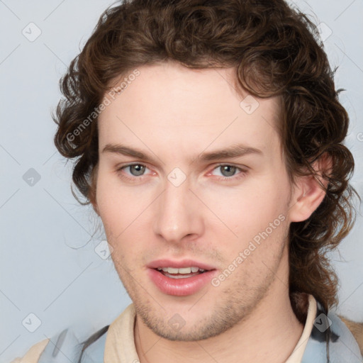 Joyful white young-adult male with medium  brown hair and brown eyes