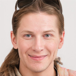 Joyful white young-adult male with medium  brown hair and blue eyes