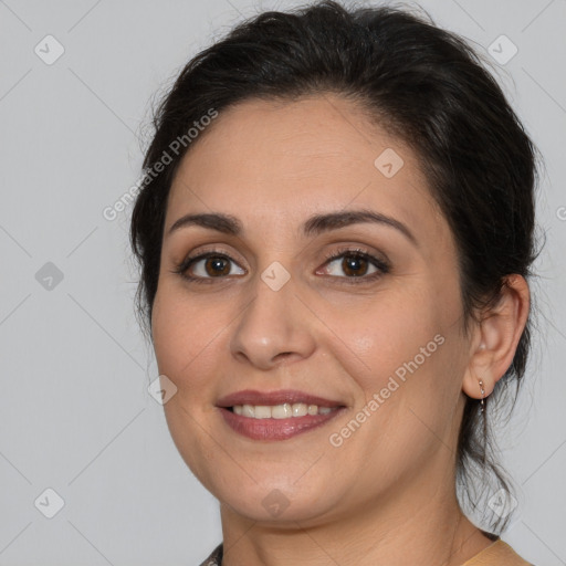 Joyful white young-adult female with medium  brown hair and brown eyes