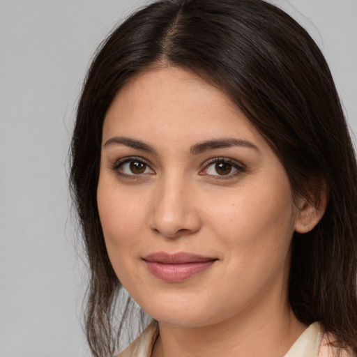 Joyful white young-adult female with medium  brown hair and brown eyes