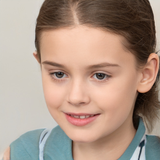 Joyful white child female with medium  brown hair and brown eyes