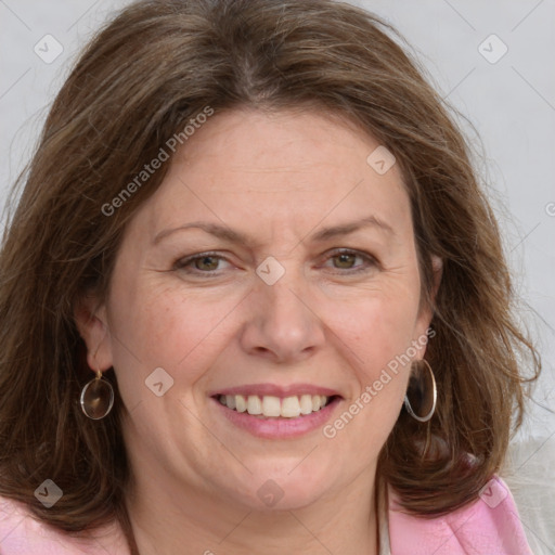 Joyful white adult female with medium  brown hair and grey eyes