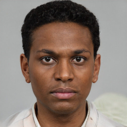 Neutral black young-adult male with short  black hair and brown eyes