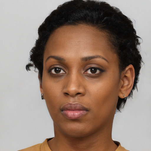 Neutral black young-adult female with short  black hair and brown eyes