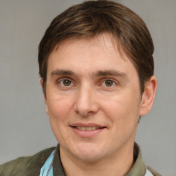 Joyful white adult male with short  brown hair and brown eyes