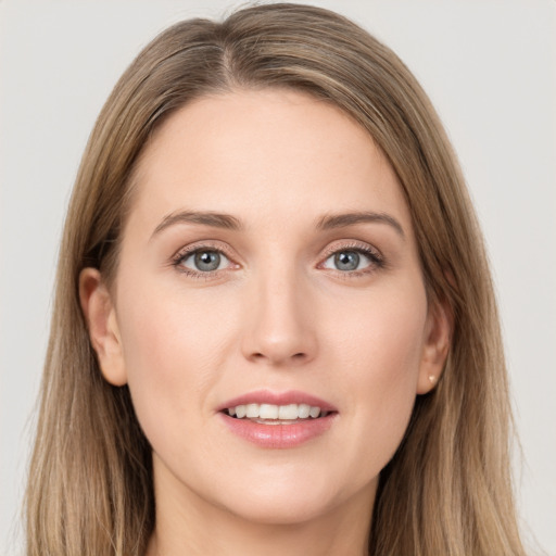 Joyful white young-adult female with long  brown hair and grey eyes