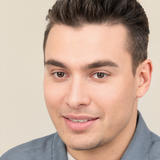 Joyful white young-adult male with short  brown hair and brown eyes