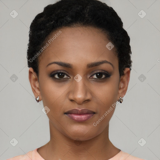 Joyful black young-adult female with short  black hair and brown eyes