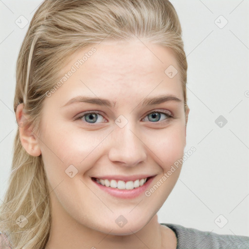 Joyful white young-adult female with long  brown hair and blue eyes