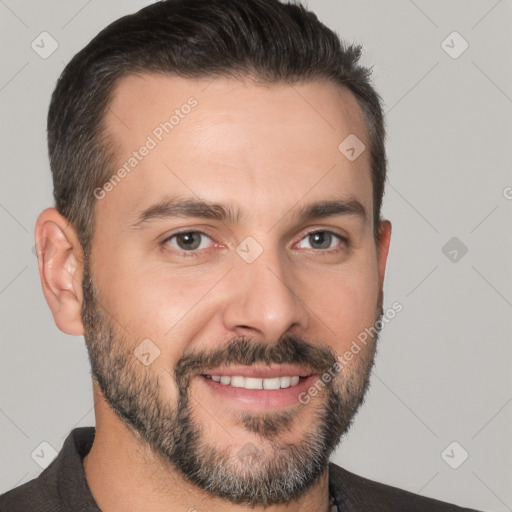 Joyful white adult male with short  brown hair and brown eyes