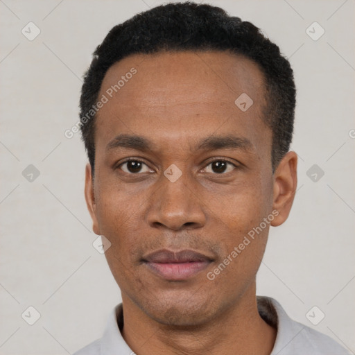 Neutral black adult male with short  black hair and brown eyes