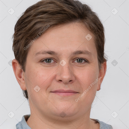 Joyful white adult female with short  brown hair and grey eyes