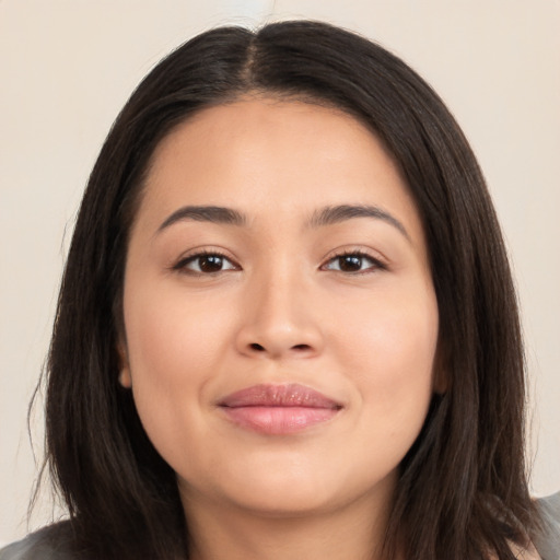 Joyful asian young-adult female with long  brown hair and brown eyes