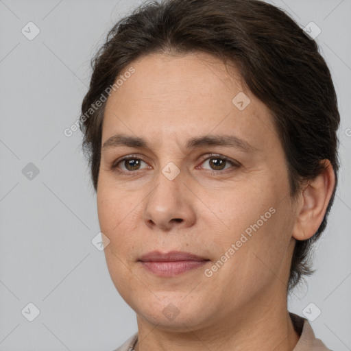 Joyful white adult female with short  brown hair and brown eyes