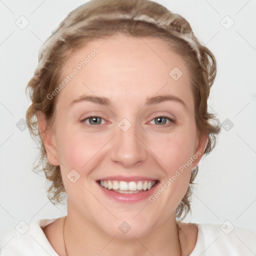 Joyful white young-adult female with medium  brown hair and blue eyes