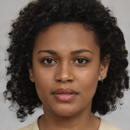 Neutral black young-adult female with medium  brown hair and brown eyes