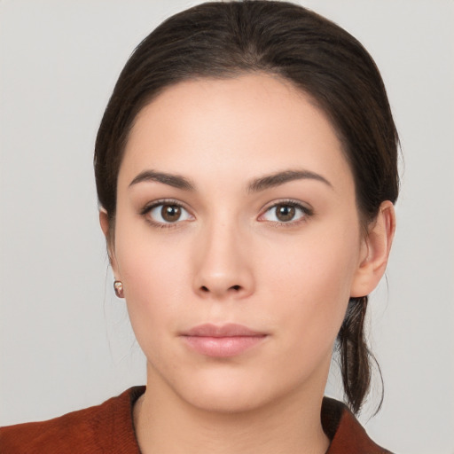 Neutral white young-adult female with medium  brown hair and brown eyes