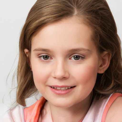 Joyful white child female with medium  brown hair and brown eyes