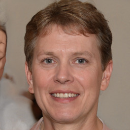 Joyful white adult male with short  brown hair and grey eyes