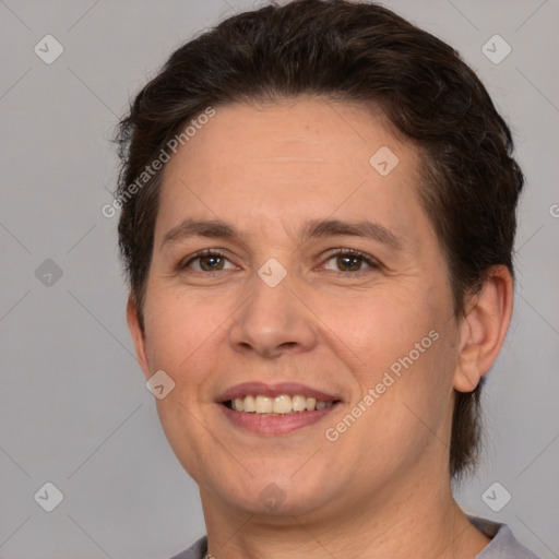 Joyful white adult female with short  brown hair and brown eyes