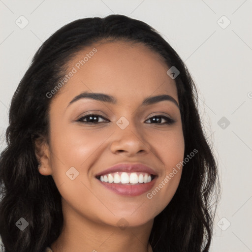 Joyful latino young-adult female with long  black hair and brown eyes